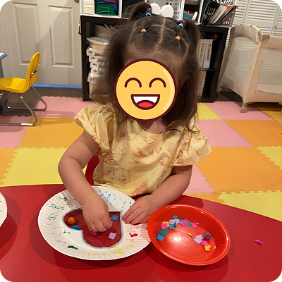 Child doing a plate craft activity
