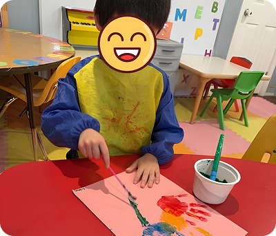 Child painting at a table